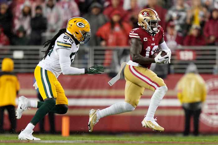 San Francisco 49ers wide receiver Deebo Samuel runs with the football against the Green Bay Packers.